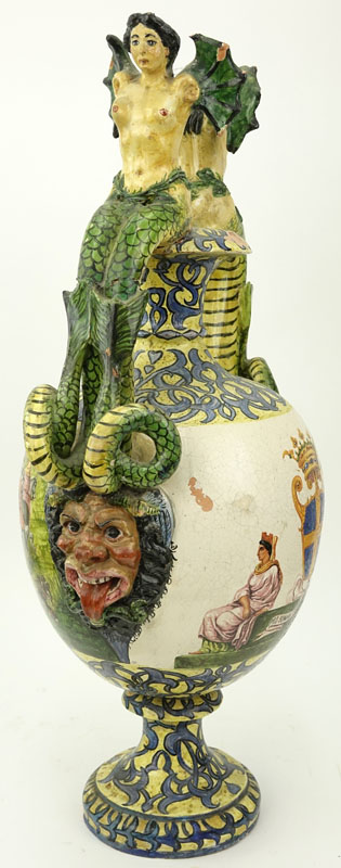 19th Century Italian Faience Majolica Renaissance Style Pottery Urn. Decorated with winged nude figural handles above figural idols, yellow ground with intertwining patterns. 