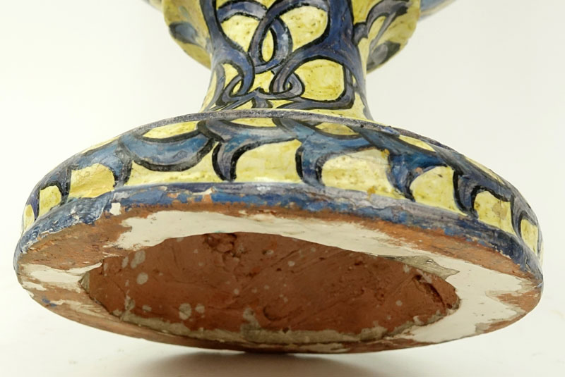 19th Century Italian Faience Majolica Renaissance Style Pottery Urn. Decorated with winged nude figural handles above figural idols, yellow ground with intertwining patterns. 