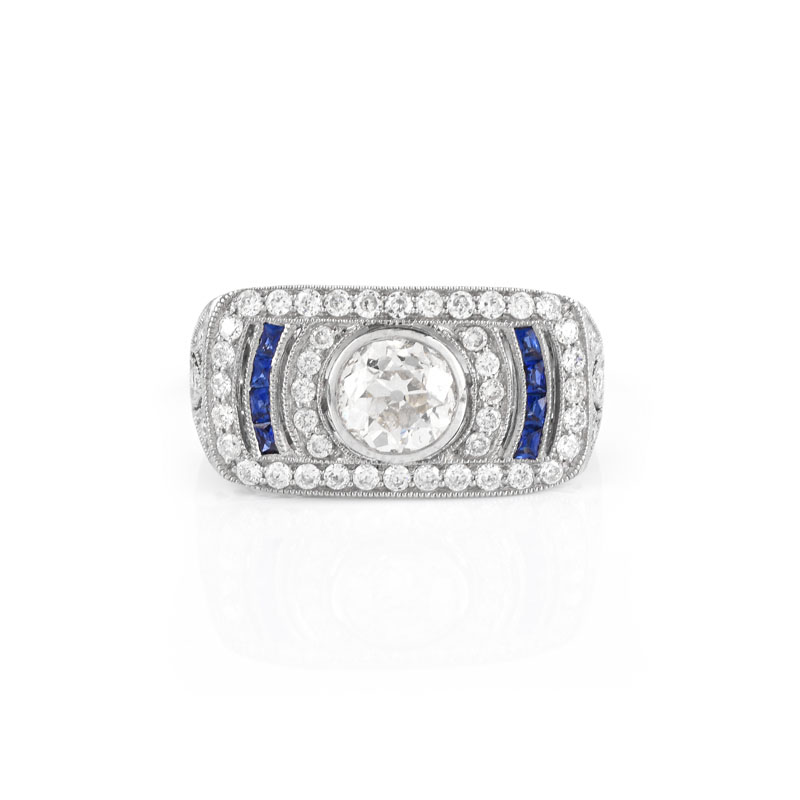 Art Deco style Approx. 1.01 Carat TW Diamond, .14 Carat Sapphire and Platinum Ring set in the Center with a .87 Carat Round Brilliant Cut Diamond.