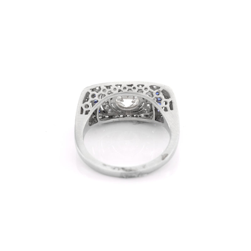 Art Deco style Approx. 1.01 Carat TW Diamond, .14 Carat Sapphire and Platinum Ring set in the Center with a .87 Carat Round Brilliant Cut Diamond.