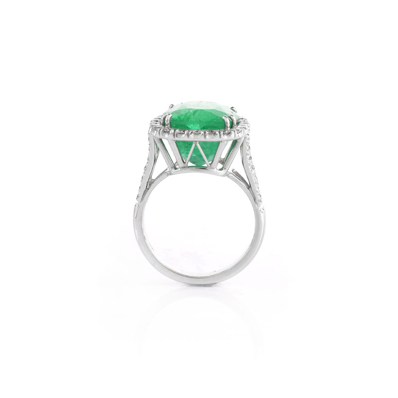 Approx. 9.0 Carat Cushion Cut Colombian Emerald, .95 Carat Round Brilliant Cut Diamond and 18 Karat White Gold Ring.