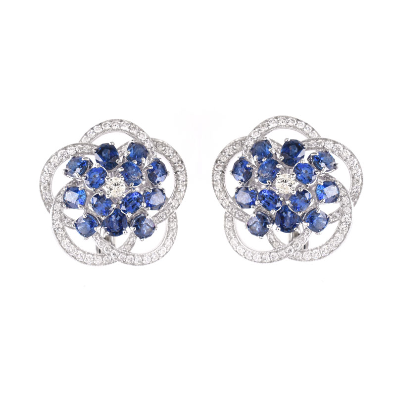 Approx. 8.50 Carat Oval Cut Sapphire, 2.85 Carat Round Brilliant Cut and Platinum earrings.