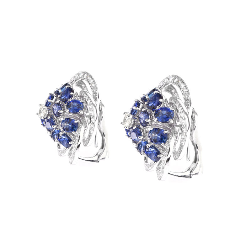 Approx. 8.50 Carat Oval Cut Sapphire, 2.85 Carat Round Brilliant Cut and Platinum earrings.