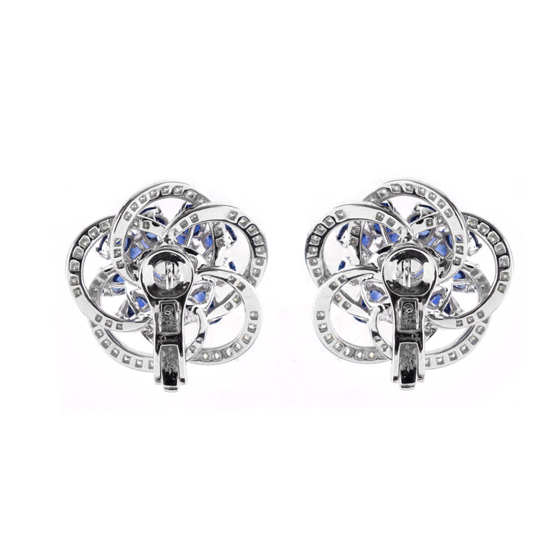 Approx. 8.50 Carat Oval Cut Sapphire, 2.85 Carat Round Brilliant Cut and Platinum earrings.