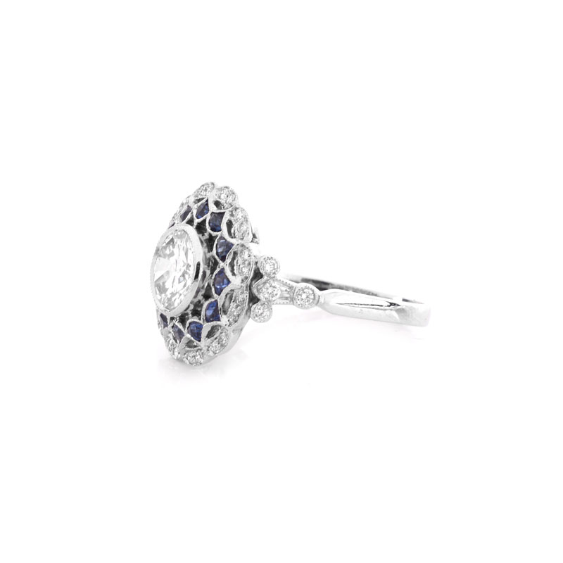 Art Deco style Approx. 1.09 Carat TW Diamond, .89 Carat Sapphire and Platinum Ring set in the Center with a .89 Carat Round Brilliant Cut Diamond.