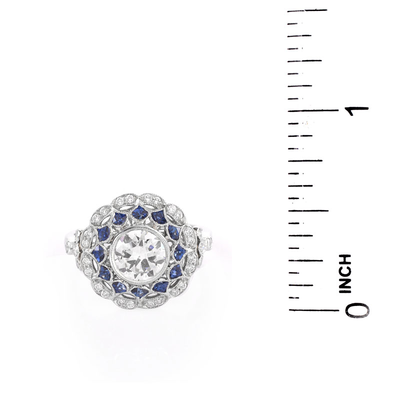 Art Deco style Approx. 1.09 Carat TW Diamond, .89 Carat Sapphire and Platinum Ring set in the Center with a .89 Carat Round Brilliant Cut Diamond.