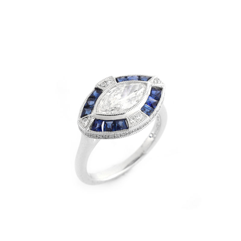 Art Deco style Approx. 1.05 Carat TW Diamond, .66 Carat Sapphire and Platinum Ring set in the Center with a .87 Carat Marquise Cut Diamond.