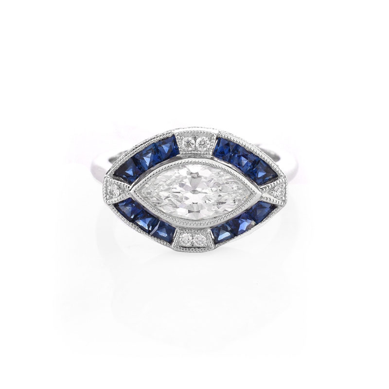 Art Deco style Approx. 1.05 Carat TW Diamond, .66 Carat Sapphire and Platinum Ring set in the Center with a .87 Carat Marquise Cut Diamond.