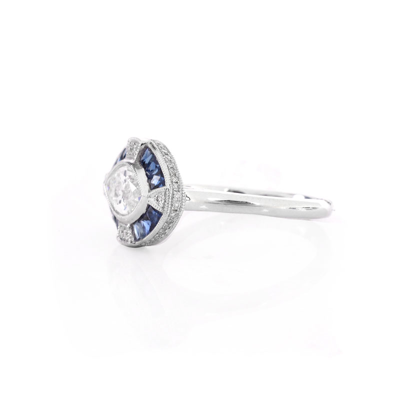 Art Deco style Approx. 1.05 Carat TW Diamond, .66 Carat Sapphire and Platinum Ring set in the Center with a .87 Carat Marquise Cut Diamond.