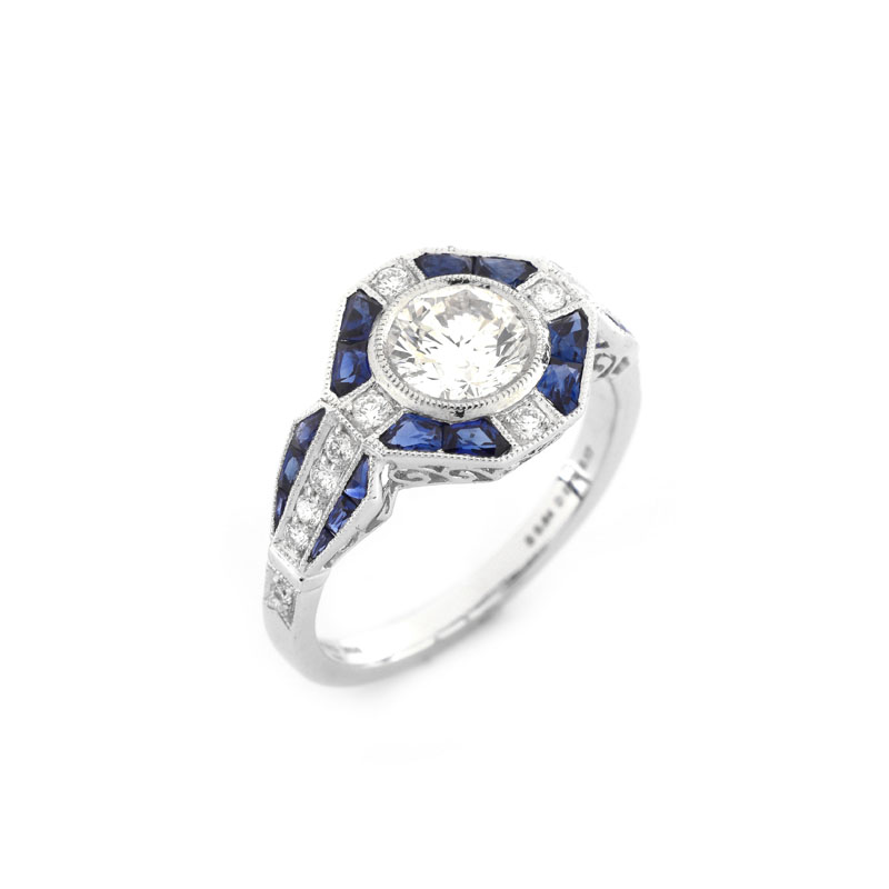 Art Deco style Approx. .96 Carat TW Diamond, .64 Carat Sapphire and Platinum Ring set in the Center with a .79 Carat Round Brilliant Cut Diamond.