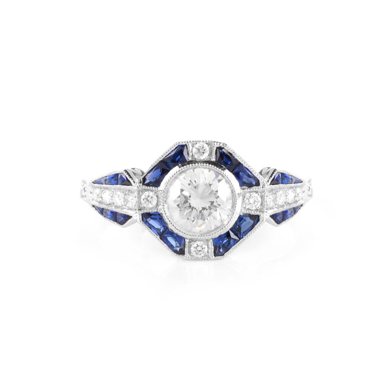 Art Deco style Approx. .96 Carat TW Diamond, .64 Carat Sapphire and Platinum Ring set in the Center with a .79 Carat Round Brilliant Cut Diamond.