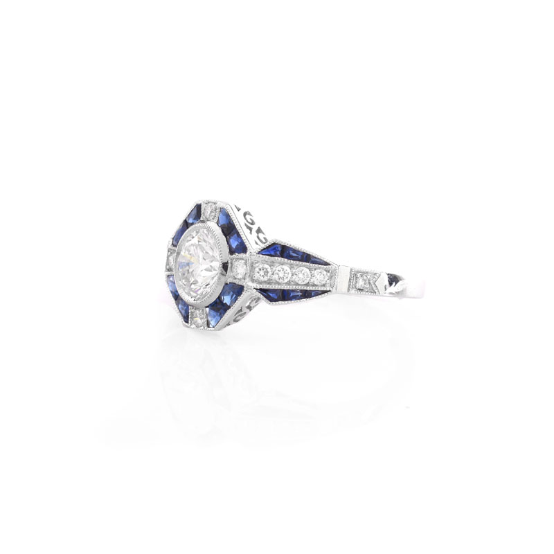 Art Deco style Approx. .96 Carat TW Diamond, .64 Carat Sapphire and Platinum Ring set in the Center with a .79 Carat Round Brilliant Cut Diamond.