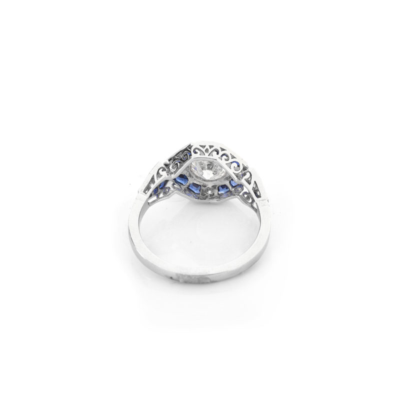 Art Deco style Approx. .96 Carat TW Diamond, .64 Carat Sapphire and Platinum Ring set in the Center with a .79 Carat Round Brilliant Cut Diamond.