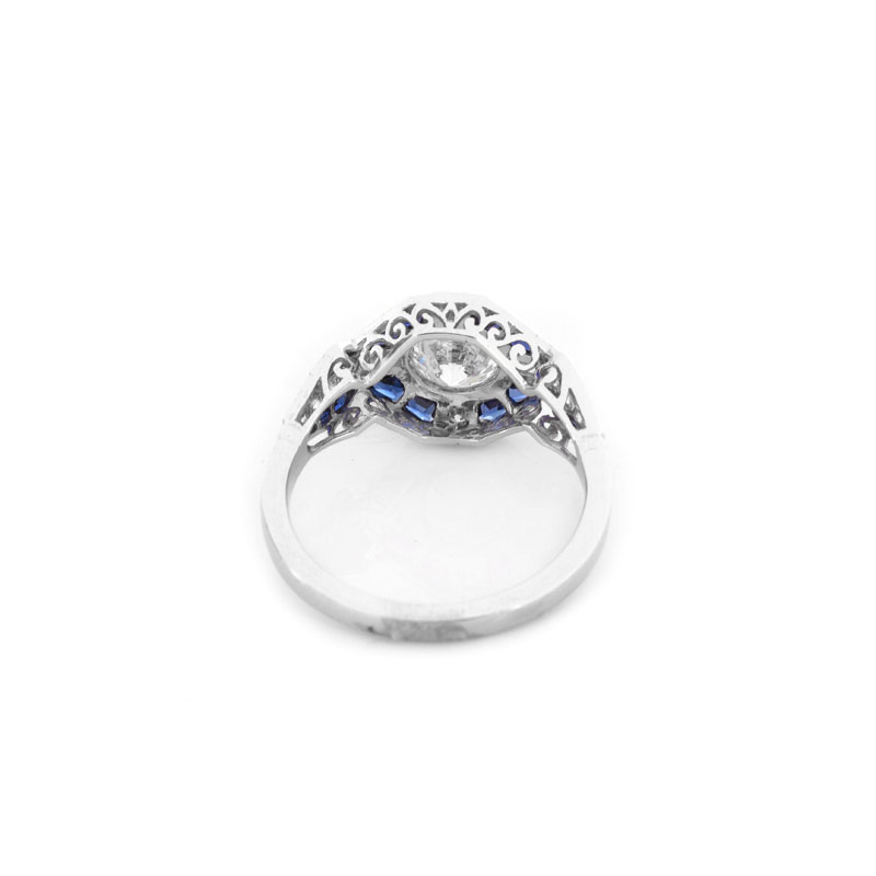 Art Deco style Approx. .96 Carat TW Diamond, .64 Carat Sapphire and Platinum Ring set in the Center with a .79 Carat Round Brilliant Cut Diamond.