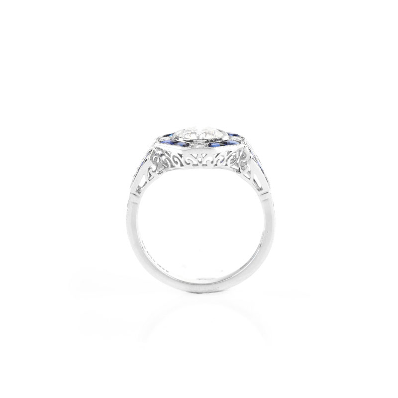 Art Deco style Approx. .96 Carat TW Diamond, .64 Carat Sapphire and Platinum Ring set in the Center with a .79 Carat Round Brilliant Cut Diamond.