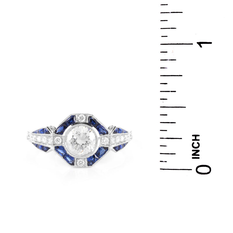 Art Deco style Approx. .96 Carat TW Diamond, .64 Carat Sapphire and Platinum Ring set in the Center with a .79 Carat Round Brilliant Cut Diamond.