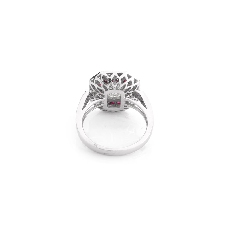 Art Deco style Approx. 1.56 Carat TW Diamond, .60 Carat Ruby and Platinum Ring set in the Center with a 1.21 Carat Emerald Cut Diamond.