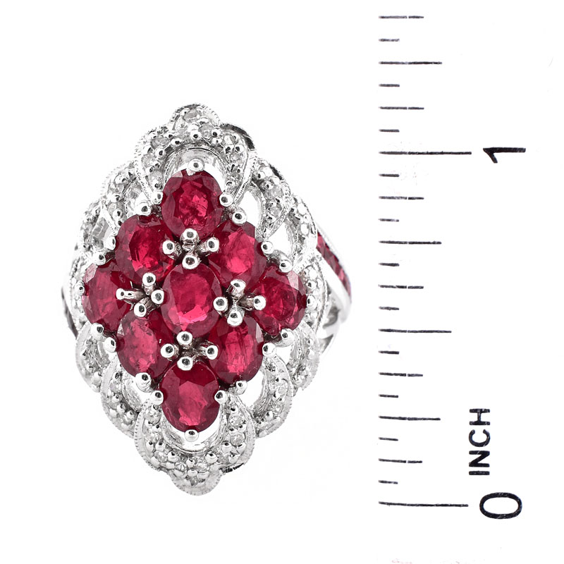 Approx. 4.50 Carat Oval Cut Ruby, 2.26 Carat Pave Set Diamond and 14 Karat White Gold Ring. Rubies with vivid color. 