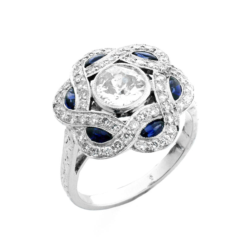 Art Deco style Diamond, Sapphire and Platinum Ring set in the Center with .66 Carat Round Brilliant Cut Diamond.