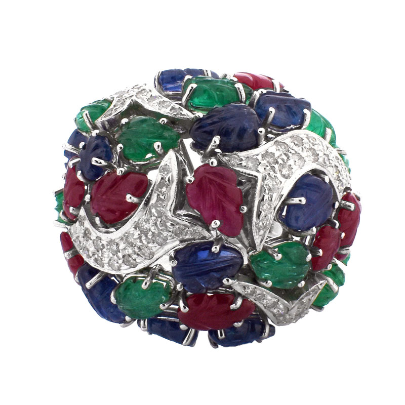 Cartier style Approx. 18.50 Carat Carved Emerald, Ruby and Sapphire, .85 Carat Diamond and 18 Karat White Gold Tutti Frutti Ring. 