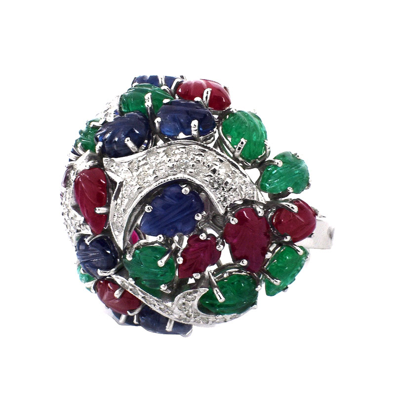 Cartier style Approx. 18.50 Carat Carved Emerald, Ruby and Sapphire, .85 Carat Diamond and 18 Karat White Gold Tutti Frutti Ring. 