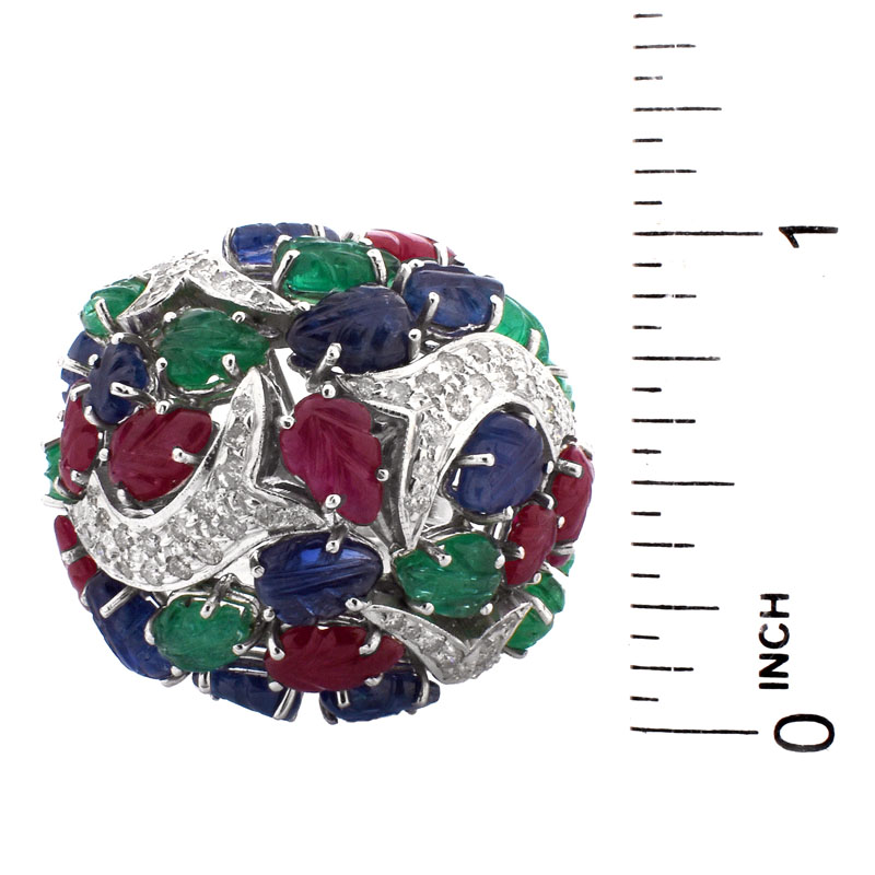 Cartier style Approx. 18.50 Carat Carved Emerald, Ruby and Sapphire, .85 Carat Diamond and 18 Karat White Gold Tutti Frutti Ring. 