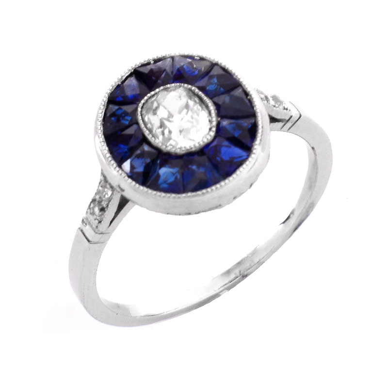 Art Deco Circa 1920s Approx. .65 Carat Old European Cut Diamond, Calibre Cut Sapphire and Platinum Ring. 