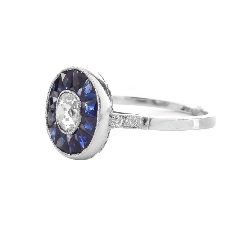 Art Deco Circa 1920s Approx. .65 Carat Old European Cut Diamond, Calibre Cut Sapphire and Platinum Ring. 