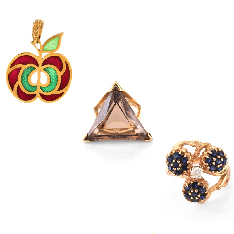 Three (3) Piece Vintage 14 Karat Yellow Gold Lot Including a Triangular Shape Topaz and 14K Ring, An Enamel and 14K Apple Pendant and a Sapphire, Diamond and 14K Ring. 