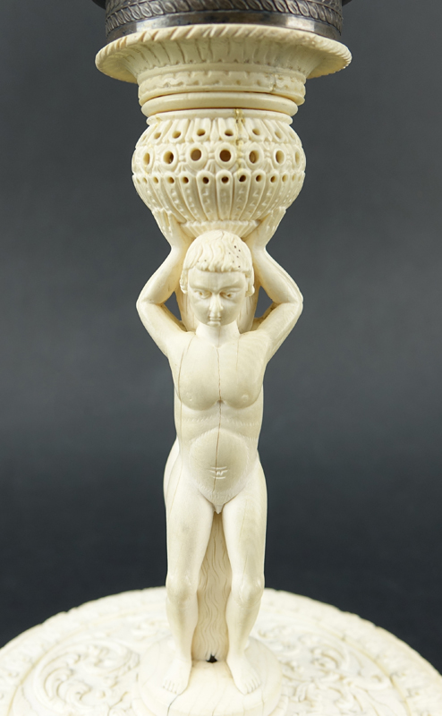 Impressive Early 19th Century Russian Imperial Carved Ivory And Silver Mounted Figural Vase And Cover. The circular base  with male figures supporting a tapered cylindrical vase carved in relief with Peter The Great and Anna Ioannovna.