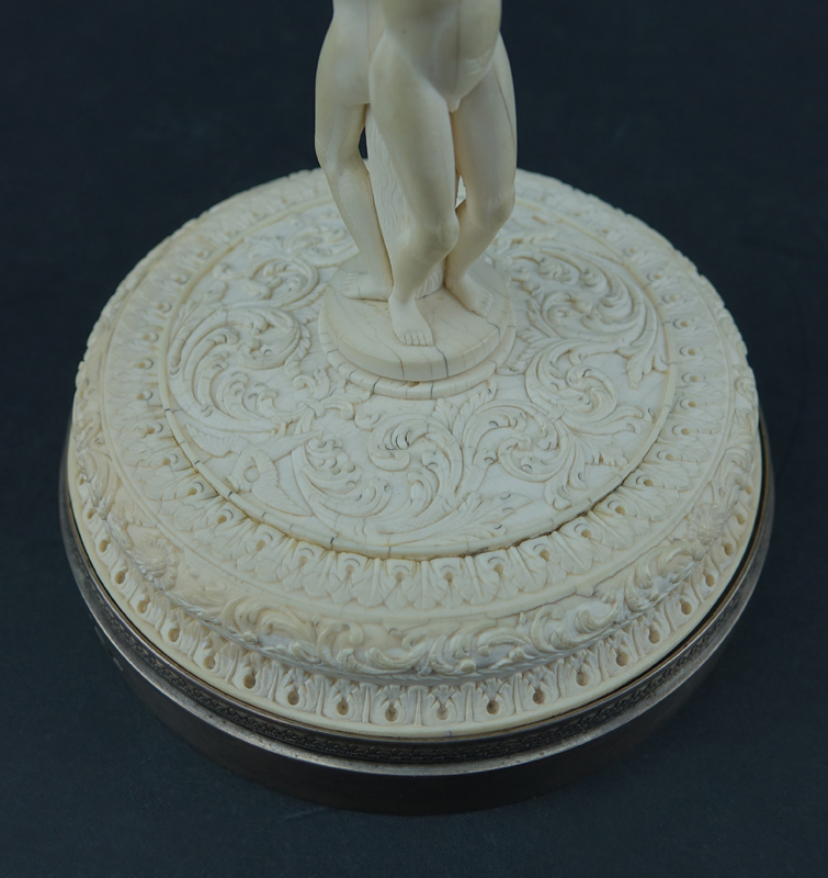 Impressive Early 19th Century Russian Imperial Carved Ivory And Silver Mounted Figural Vase And Cover. The circular base  with male figures supporting a tapered cylindrical vase carved in relief with Peter The Great and Anna Ioannovna.