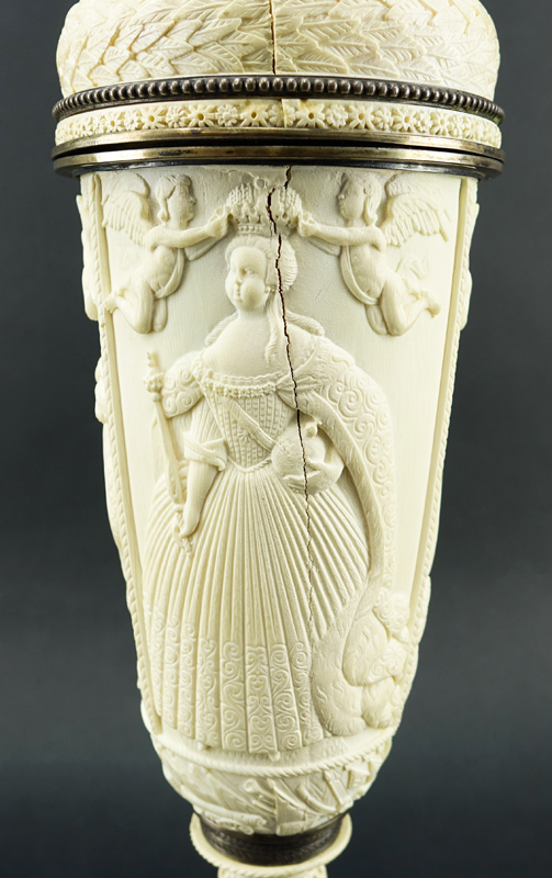 Impressive Early 19th Century Russian Imperial Carved Ivory And Silver Mounted Figural Vase And Cover. The circular base  with male figures supporting a tapered cylindrical vase carved in relief with Peter The Great and Anna Ioannovna.