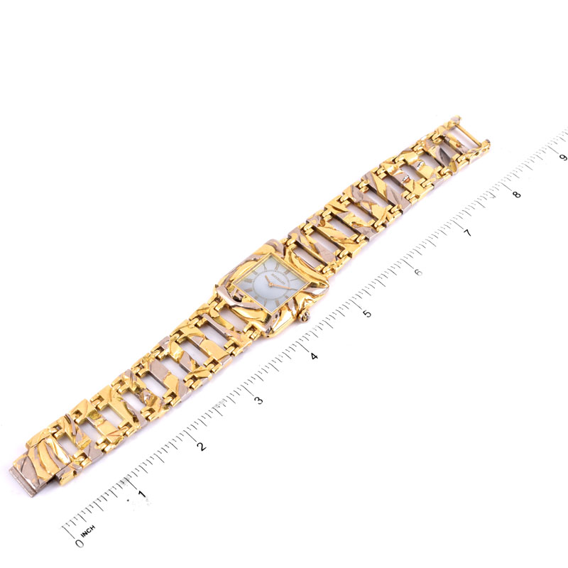 Man's Circa 1973 Buccellati Two Tone 18 Karat Gold Bracelet Watch with Mother of Pearl Dial and Manual Movement.