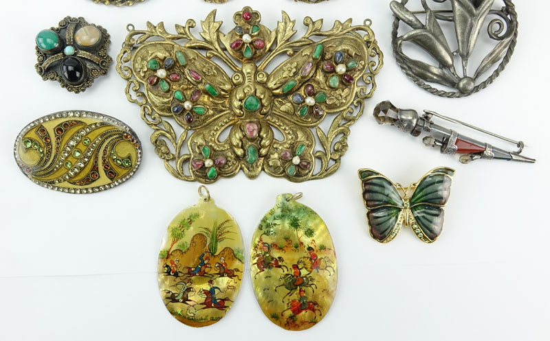 Lot of Thirteen (13) Vintage Costume Jewelry. Includes: assorted bejewelled Pins/brooches, pins, pendant, and earring.