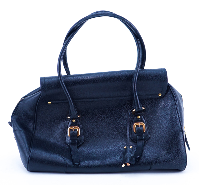 Prada Black Leather Handbag. Gold-tone hardware. Original ID tag. Lock & Keys in clouchette. Prada fabric interior.