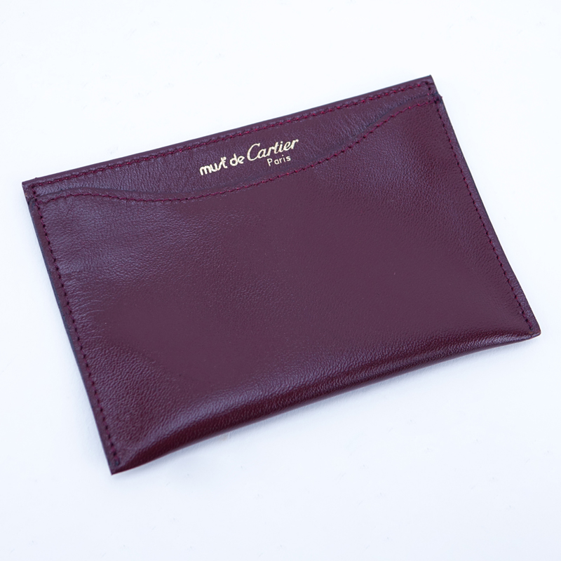Cartier Brown Leather Card Holder. In original box. Embossed Must de Cartier.
