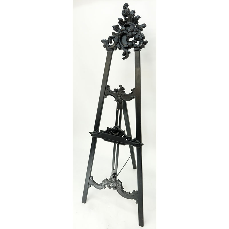Large Carved Wood Easel. Typical scuffs and scratches to wood overall. Measures 74" H x 20-1/4" W. 