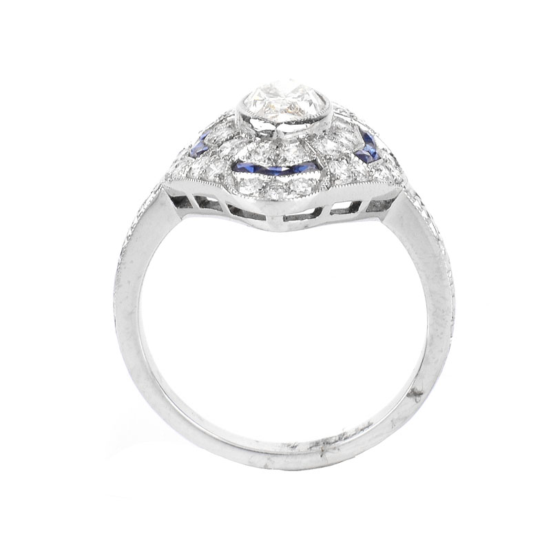 Art Deco style Approx. 1.61 Carat TW Diamond, 1.44 Carat Sapphire and Platinum Ring set in the Center with a 1.02 Carat Marquise Cut Diamond. 