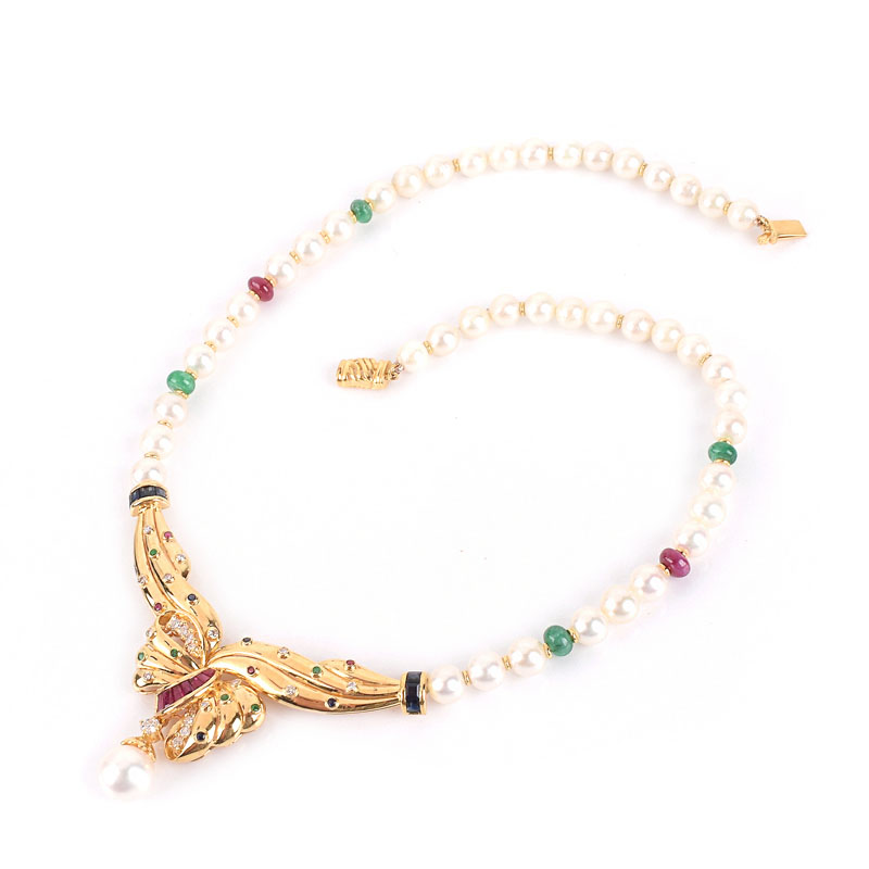 Vintage 18 Karat Yellow Gold and Pearl Pendant Necklace Accented Throughout with Round Brilliant Cut Diamonds, Rubies, Emerald and Sapphires. 