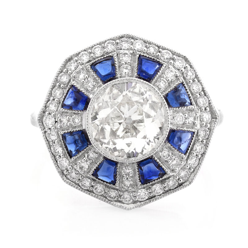 Art Deco style Approx. 1.44 Carat TW Diamond, .70 Carat Sapphire and Platinum Ring set in the Center with a 1.07 Carat Round Brilliant Cut Diamond. 