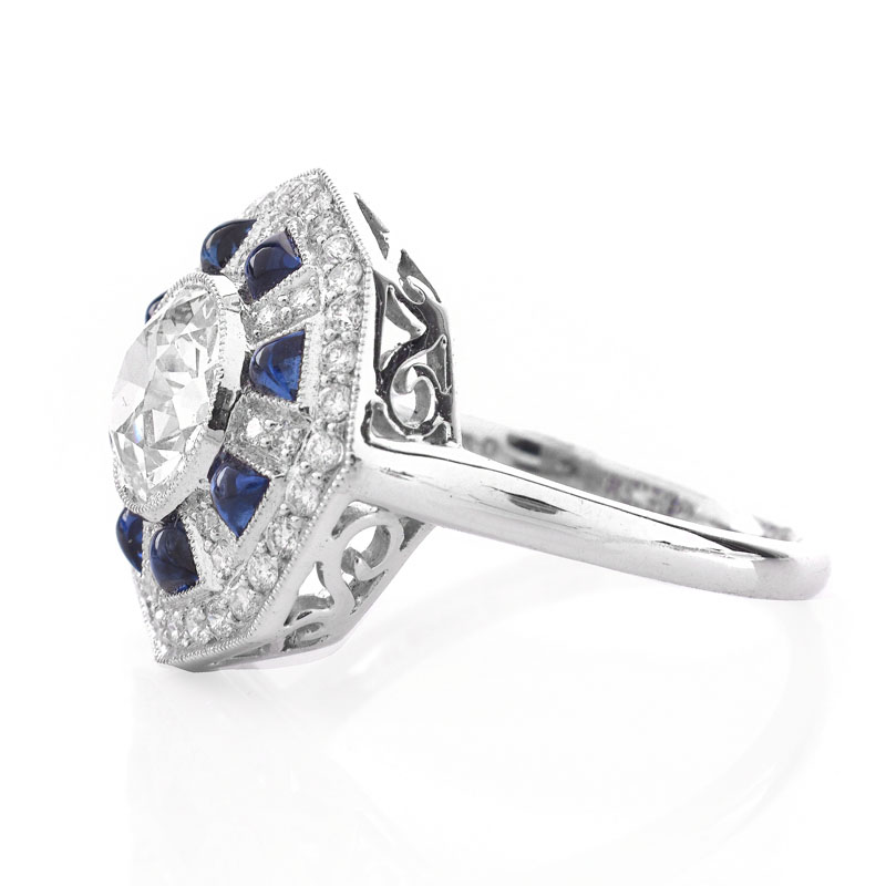 Art Deco style Approx. 1.44 Carat TW Diamond, .70 Carat Sapphire and Platinum Ring set in the Center with a 1.07 Carat Round Brilliant Cut Diamond. 