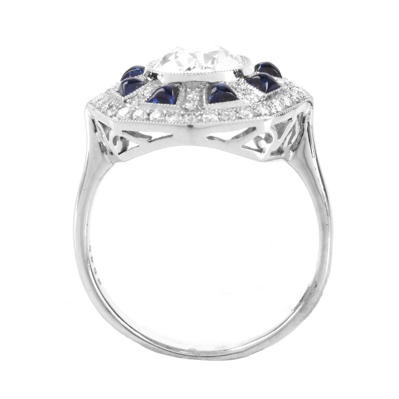 Art Deco style Approx. 1.44 Carat TW Diamond, .70 Carat Sapphire and Platinum Ring set in the Center with a 1.07 Carat Round Brilliant Cut Diamond. 