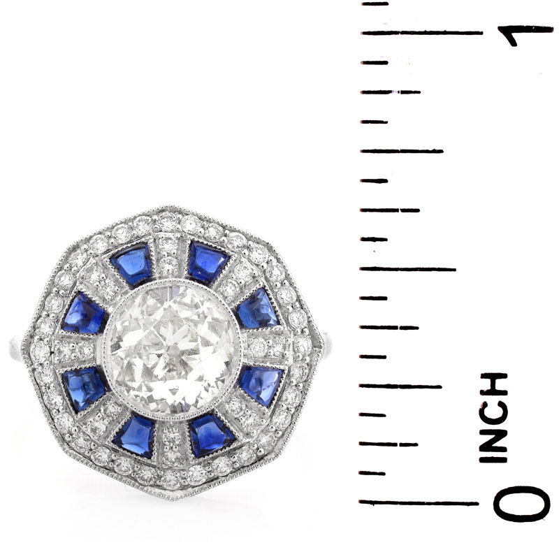 Art Deco style Approx. 1.44 Carat TW Diamond, .70 Carat Sapphire and Platinum Ring set in the Center with a 1.07 Carat Round Brilliant Cut Diamond. 