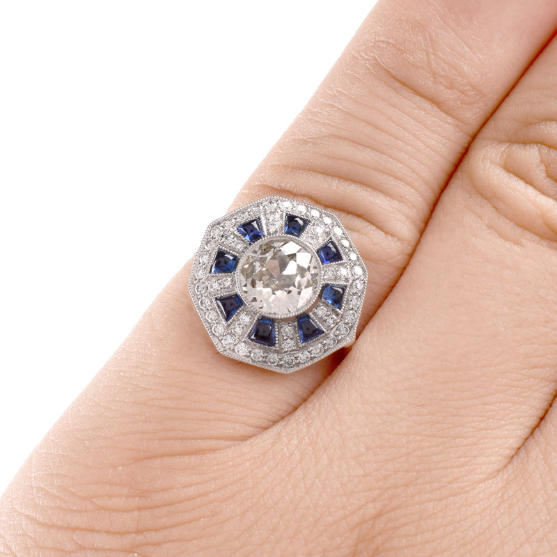 Art Deco style Approx. 1.44 Carat TW Diamond, .70 Carat Sapphire and Platinum Ring set in the Center with a 1.07 Carat Round Brilliant Cut Diamond. 