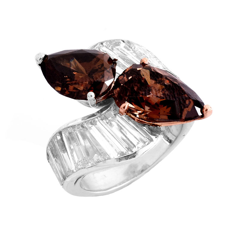 GIA Certified Vintage 4.06 and 3.04 Carat Pear Shape Fancy Dark Orangy Brown Diamond, Tapered Baguette Diamond and Platinum Cross Over Ring. 