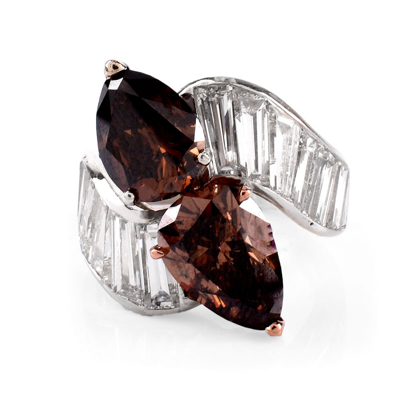 GIA Certified Vintage 4.06 and 3.04 Carat Pear Shape Fancy Dark Orangy Brown Diamond, Tapered Baguette Diamond and Platinum Cross Over Ring. 