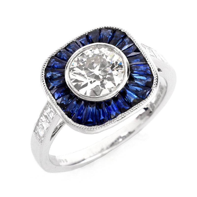 Art Deco style Approx. 1.14 Carat TW Diamond, .87 Carat Sapphire and Platinum Ring set in the Center with a .91 Carat Round Brilliant Cut Diamond. 