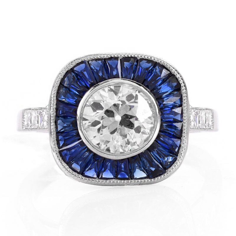 Art Deco style Approx. 1.14 Carat TW Diamond, .87 Carat Sapphire and Platinum Ring set in the Center with a .91 Carat Round Brilliant Cut Diamond. 