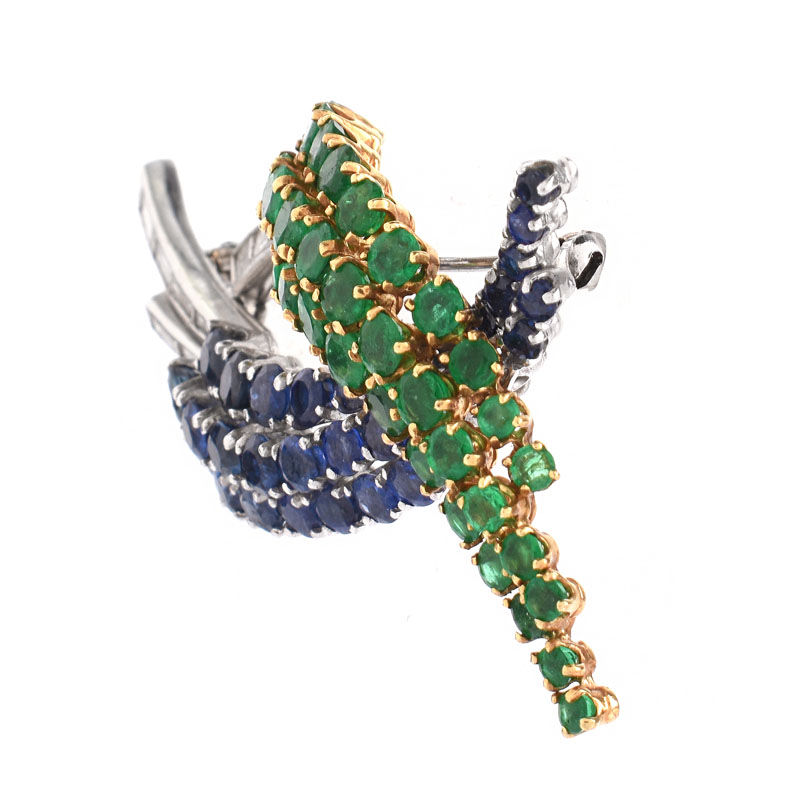 Vintage Round Cut Emerald and Sapphire, Baguette Cut Diamond, Platinum and 18 Karat Yellow Gold Brooch. 