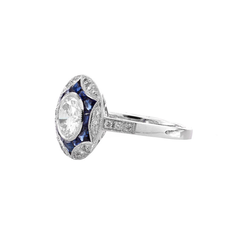 Art Deco style Approx. 1.20 Carat TW Diamond, .64 Carat Sapphire and Platinum Ring set in the Center with a .97 Carat Round Brilliant Cut Diamond. 